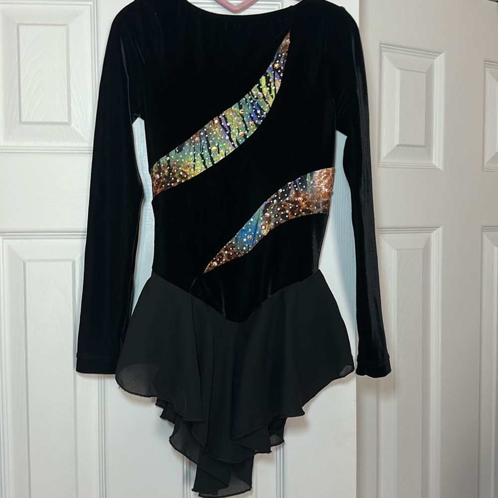 Figure scaring black Leo with skirt and gems